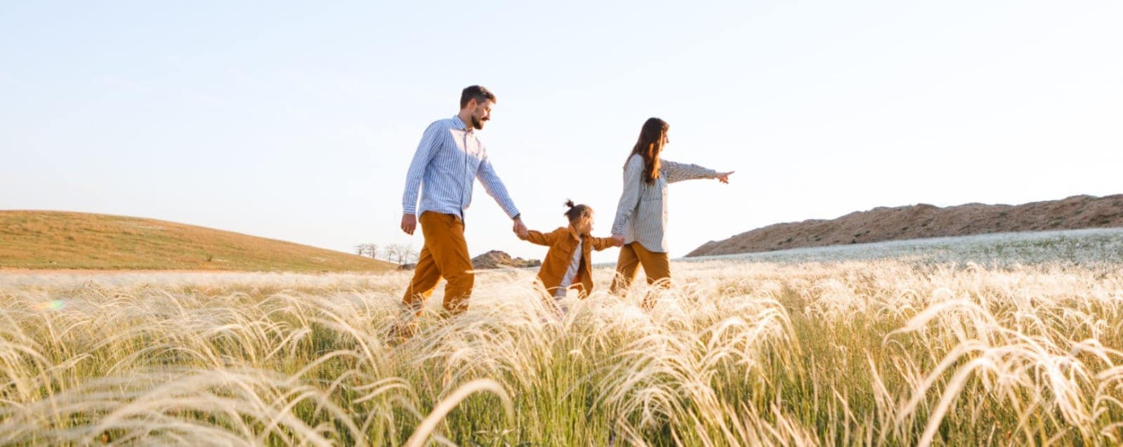 WhatsApp Image 2025-02-16 at 13.48.51 Family walking through meadow illustrating wealth protection and generational planning
